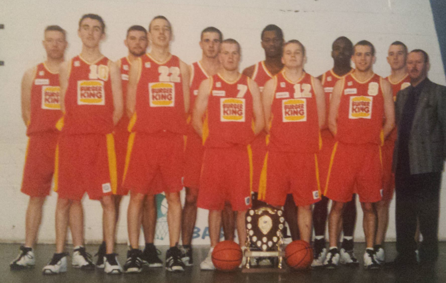 Burger King Limerick squad lined up with a trophy and basketballs