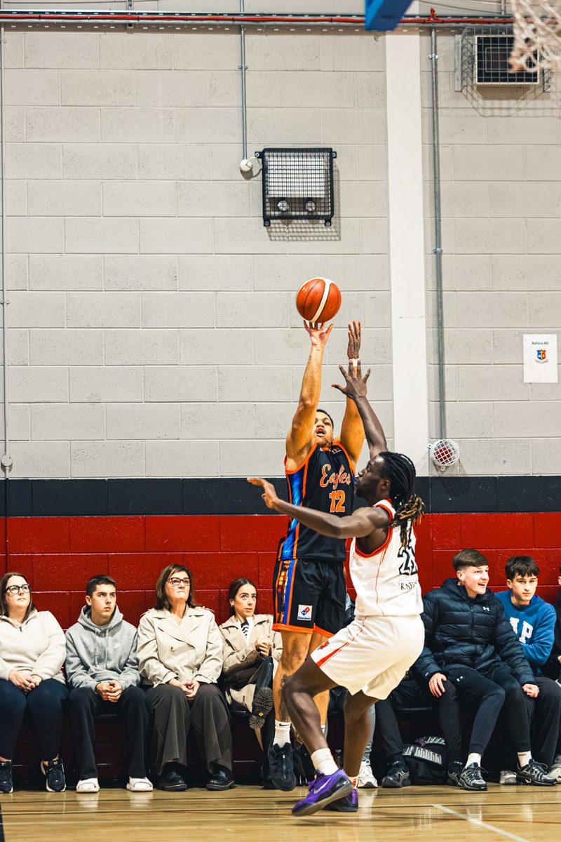 Aaron Rhooms shoots a jump shot